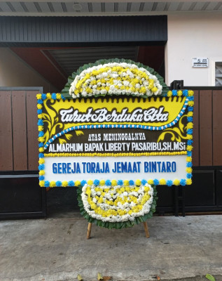 Papan Bunga Duka di Pisugi